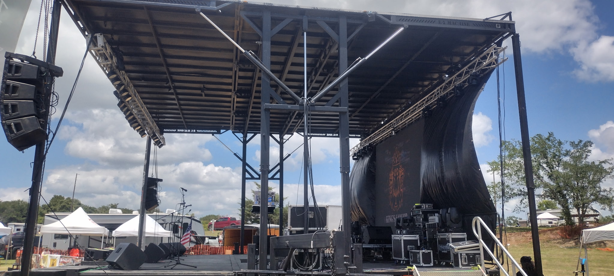 Large indoor event with lighting rig and audience